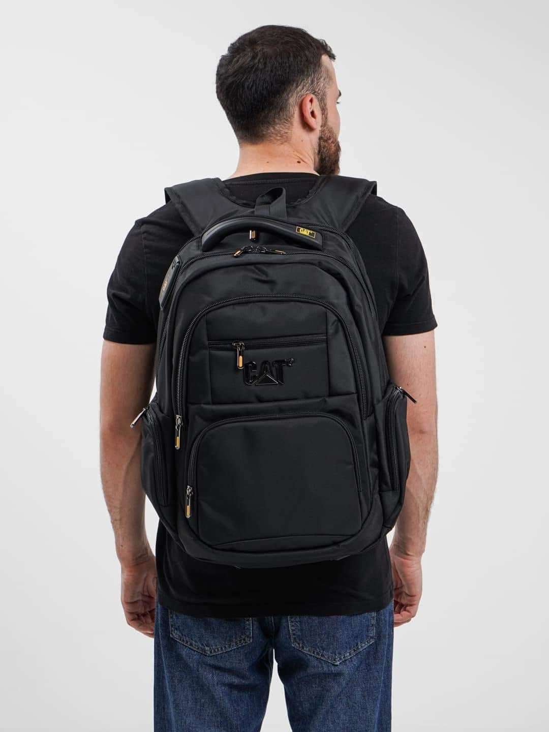 Caterpillar Business Travel Backpack with USB Charging Port & AUX Cable 15.6″ with Bubble Padding Laptop Compartment with Rain Cover Men & Women